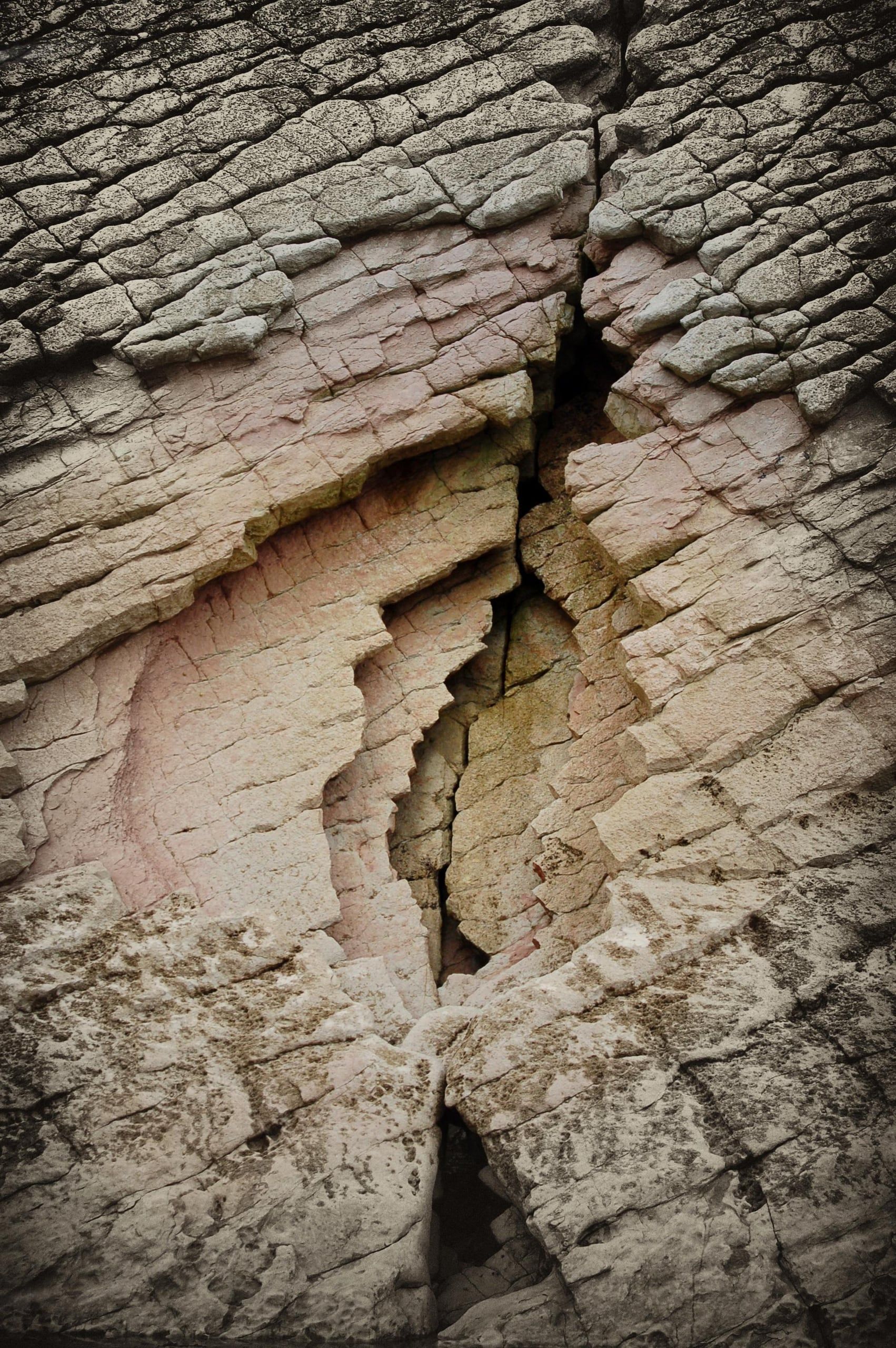 Close-up of a crack and the folded layers of the flysch rock